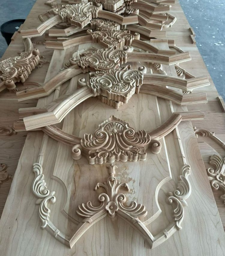 Decorative carved wood components for cabinet panels