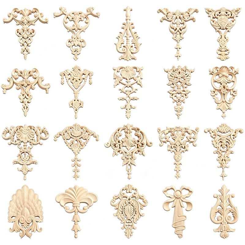 Vertical carved wood appliques with ornamental floral and pendant designs