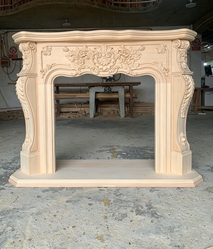 Carved wooden fireplace mantel with decorative details